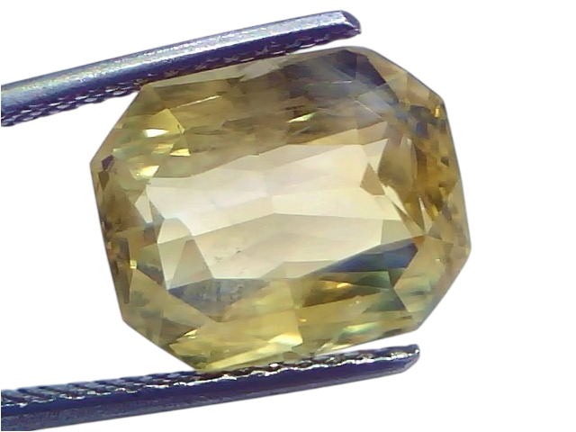Huge 10.09 Carat IGI Certified Unheated Natural Ceylon Yellow Sapphire Pukhraj, octagonal cut, held with tweezers.