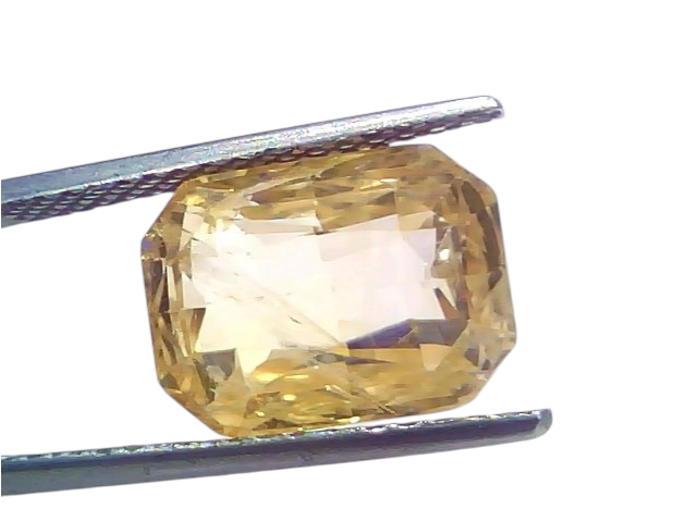 Huge 10.39 Ct IGI Certified Unheated Natural Ceylon Yellow Sapphire Pukhraj, displayed in tweezers against a white background