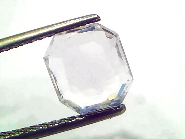 2.85 Ct Gii Certified Unheated Untreated Natural Ceylon White Sapphire, octagonal cut, held between tweezers, clear and spark