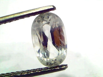 2.95 Ct Gii Certified Unheated Untreated Natural Ceylon White Sapphire held by tweezers, showcasing its clarity and brillianc
