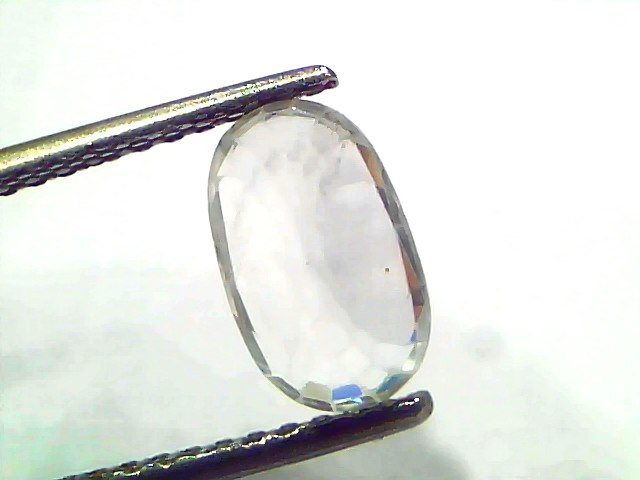 2.95 Ct Gii Certified Unheated Untreated Natural Ceylon White Sapphire, oval-cut gemstone held by tweezers, showcasing clarit