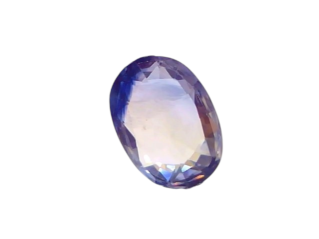 2.17 carat certified yellow blue Pitambari sapphire held by tweezers, showcasing its oval cut and vibrant colors.