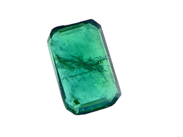 Natural Zambian emerald, 2.15 carats, untreated, octagonal cut, displayed between tweezers against a white background.