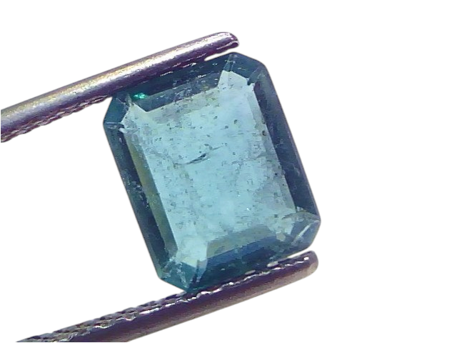 2.67 Carat Certified Natural Zambian Emerald, untreated, in emerald cut, held by tweezers against a white background.