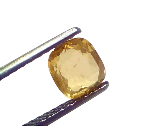 Natural Ceylon yellow sapphire held by tweezers, showcasing its vibrant yellow hue and cushion cut. 2.02 Ct.