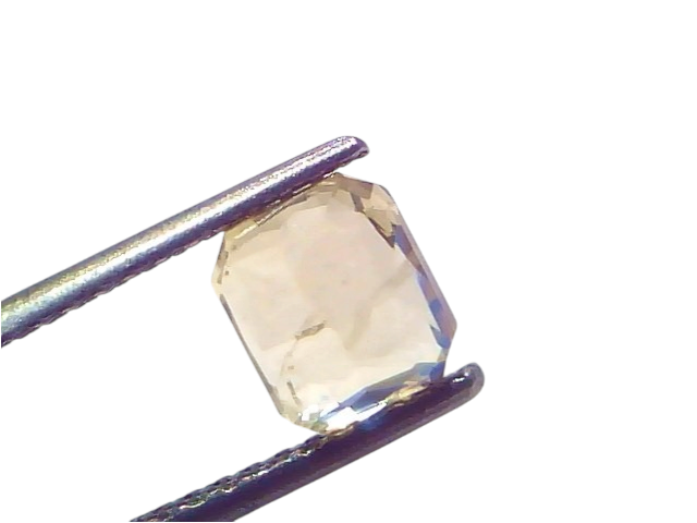 2.53 Ct Certified Unheated Natural Ceylon Yellow Sapphire Pukhraj displayed in tweezers, showcasing its radiant yellow hue an