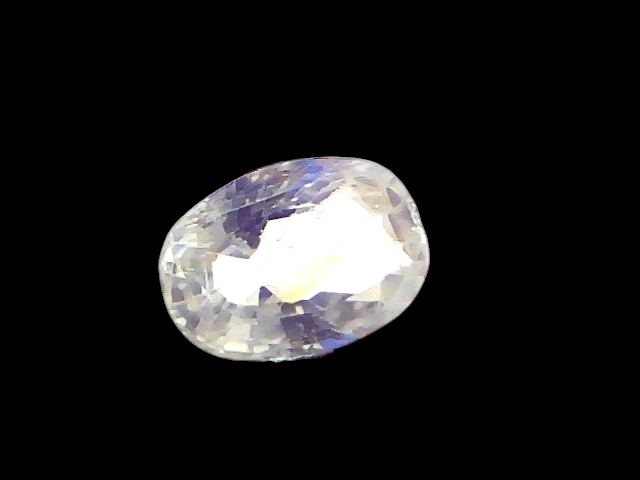2.05 Ct Certified Unheated Untreated Natural Ceylon White Sapphire, oval-shaped, held by tweezers, showcasing clarity and bri