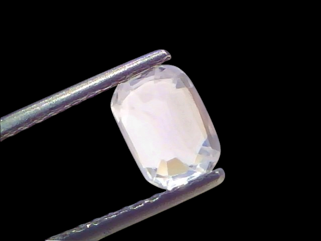 2.02 Ct Certified Unheated Natural Ceylon White Sapphire, Safed Pukhraj, displayed in tweezers against a light background.