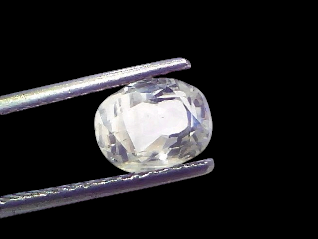 1.97 Ct Certified Unheated Untreated Natural Ceylon White Sapphire held by tweezers, showcasing its clarity and brilliance.