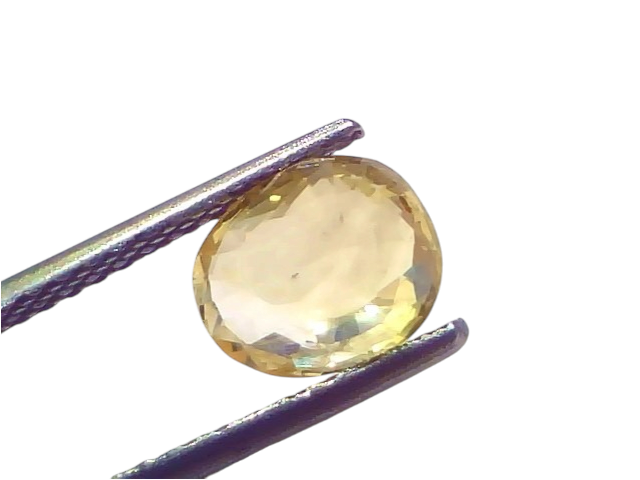 A 2.12 Ct certified unheated natural Ceylon yellow sapphire, held with tweezers, showcasing its oval cut and clarity.