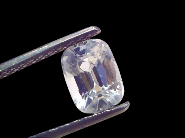 2.02 Ct Certified Unheated Natural Ceylon White Sapphire, Safed Pukhraj, displayed in tweezers against a light background.