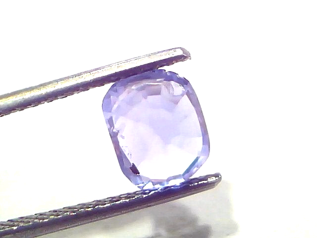 Ceylon Blue Sapphire by Venus Gems, 2.30 carats, unheated, cushion cut, held by tweezers against a light background.