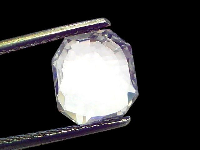 2.85 Ct Gii Certified Unheated Untreated Natural Ceylon White Sapphire, octagonal cut, held between tweezers, clear and spark