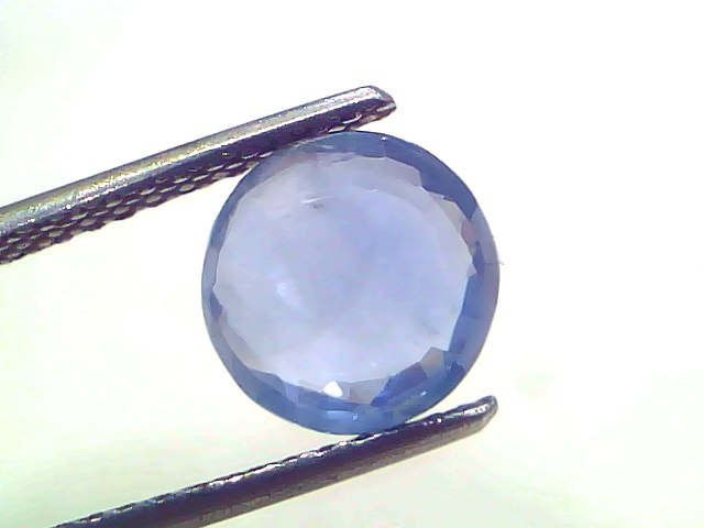3.02 Ct Certified Unheated Untreated Natural Ceylon Blue Sapphire, round faceted gem held by tweezers against a light backgro