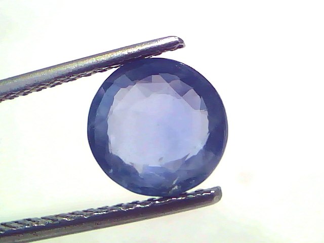3.02 Ct Certified Unheated Untreated Natural Ceylon Blue Sapphire, round cut, displayed between tweezers against a light back