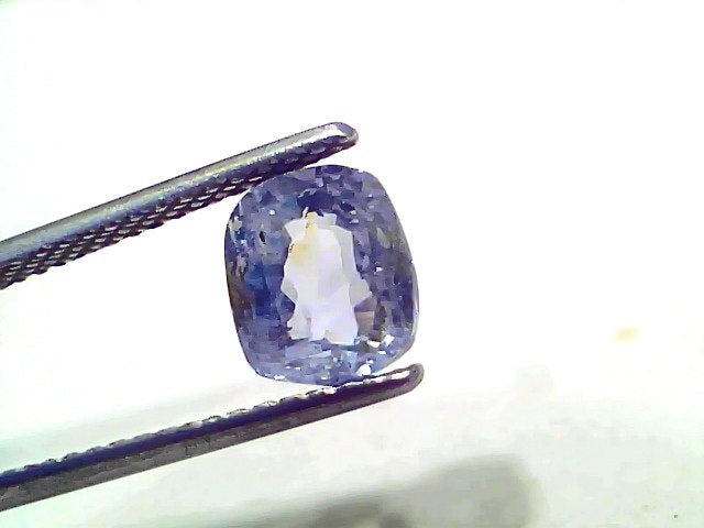 3.15 Ct unheated untreated natural Ceylon yellow blue Pitambari sapphire held by tweezers, showcasing its cushion cut and cla