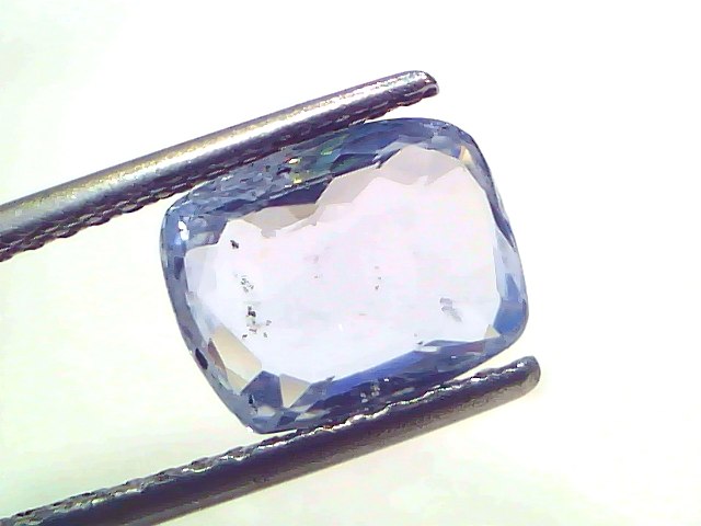 3.50 Ct Certified Unheated Untreated Natural Ceylon Blue Sapphire, displayed on tweezers, showcasing its clear blue hue and f