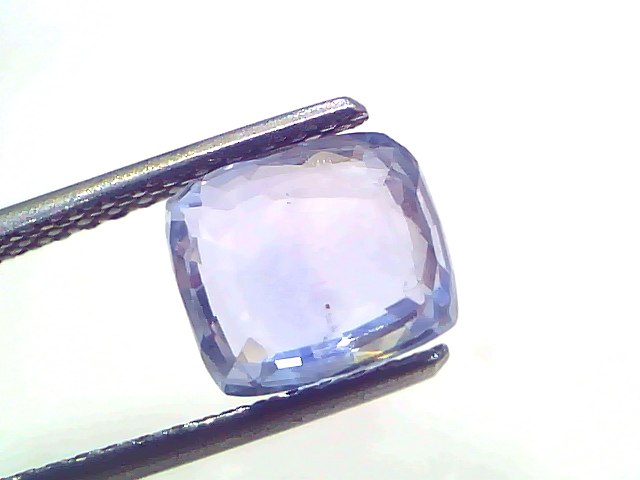 3.54 Ct Certified Unheated Untreated Natural Ceylon Blue Sapphire, displayed with tweezers against a white background.