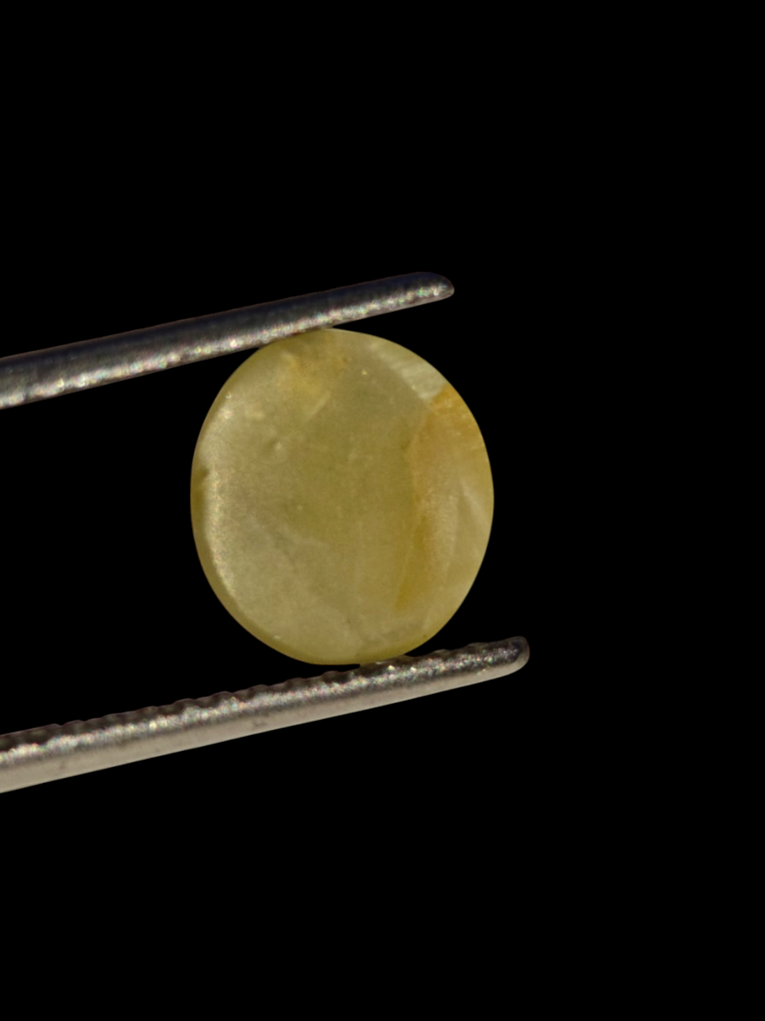 Venus Gems 3.23 carat natural green Chrysoberyl Cat's Eye gemstone with sharp chatoyancy in an oval cabochon cut.