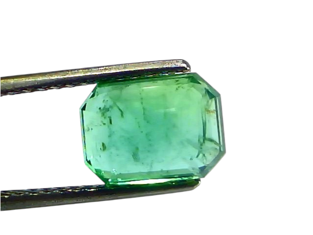 3.61 carat certified natural Zambian emerald, untreated, octagonal cut, held with tweezers against a white background.