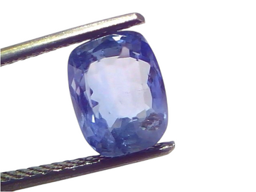 3.64 carat IGI certified unheated natural Ceylon blue sapphire, cushion cut, displayed in tweezers against a white background