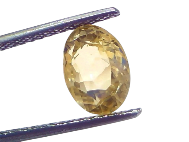 3.05 carat IGI certified unheated natural Ceylon yellow sapphire in an oval cut, held by tweezers against a light background.