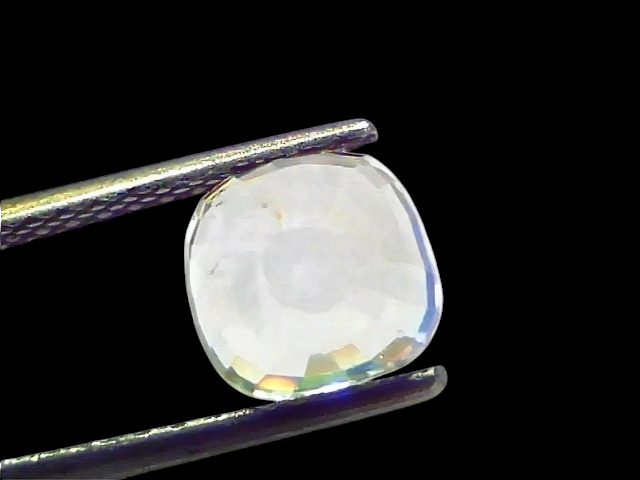 3.62 Ct Gii Certified Unheated Untreated Natural Ceylon White Sapphire held by tweezers, showcasing its clarity and brillianc
