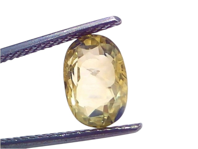 3.76 Ct IGI Certified unheated natural Ceylon yellow blue Pitambari sapphire, displayed in tweezers against a white backgroun