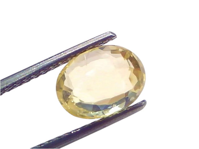 3.64 Ct IGI Certified Unheated Natural Ceylon Yellow Sapphire Pukhraj, oval cut, held with tweezers against a light backgroun