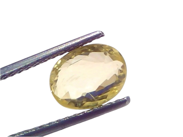 3.64 Ct IGI Certified Unheated Natural Ceylon Yellow Sapphire Pukhraj, oval cut, held with tweezers against a light backgroun