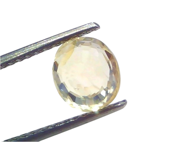 3.16 Ct IGI Certified Unheated Natural Ceylon Yellow Sapphire Pukhraj, oval cut, held by tweezers against a light background.