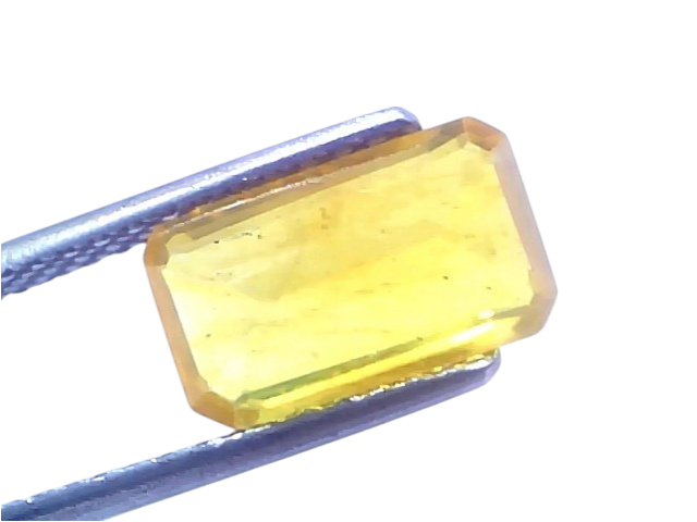 Natural yellow sapphire gemstone in an emerald cut, weighing 3.58 carats and 3.97 ratti, with a bright yellow hue.