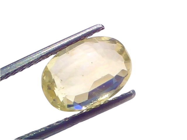 3.63 Ct IGI Certified Unheated Natural Ceylon Yellow Sapphire Pukhraj held by tweezers, showcasing its brilliant yellow hue a
