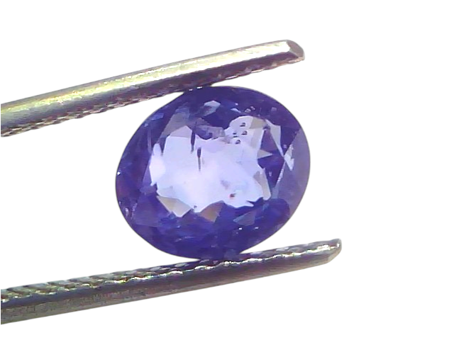 3.09 carat IGI certified unheated natural Ceylon blue sapphire held with tweezers, showcasing its deep blue color and brillia