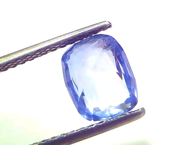 3.64 carat IGI certified unheated natural Ceylon blue sapphire, cushion cut, displayed in tweezers against a white background