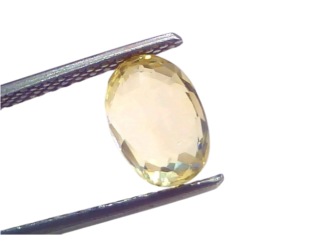 3.27 Ct IGI Certified Unheated Natural Ceylon Yellow Sapphire Pukhraj, oval cut, held by tweezers against a light background.