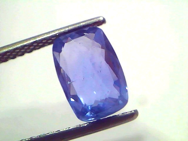 A 3.00 Ct IGI Certified unheated natural Ceylon blue sapphire, showing a rectangular cut with a vivid blue hue.
