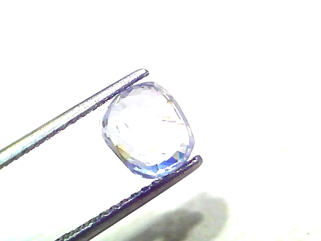 3.15 Ct unheated untreated natural Ceylon yellow blue Pitambari sapphire held by tweezers, showcasing its cushion cut and cla