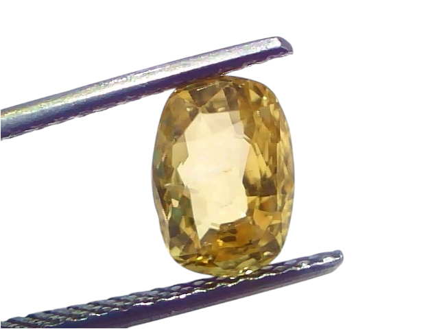 A 3.08 carat IGI certified yellow sapphire (Pukhraj) held by tweezers, showcasing its unheated, radiant cut and vibrant yello