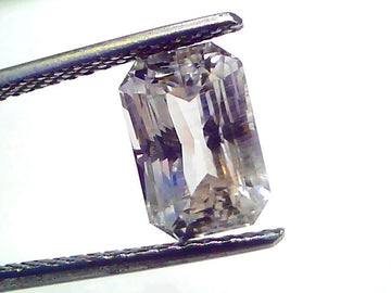 4.09 Ct Gii Certified Unheated Untreated Natural Ceylon White Sapphire, octagonal cut, held by tweezers against a white backg