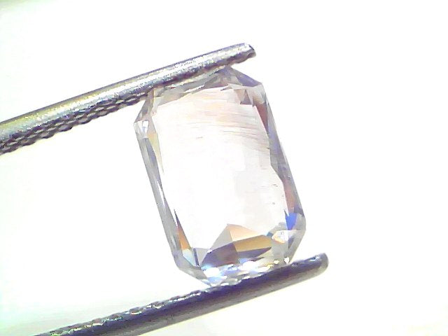 4.09 Ct Gii Certified Unheated Untreated Natural Ceylon White Sapphire, octagonal cut, held by tweezers against a white backg
