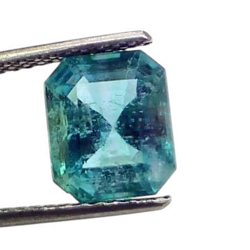 4.00 Ct GII Certified Untreated Natural Zambian Emerald, octagonal cut, vibrant green color, held with tweezers.