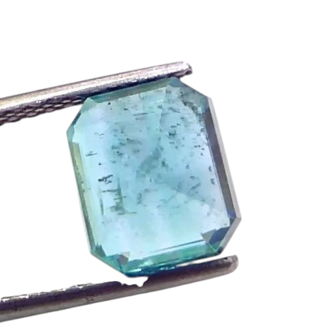 4.00 Ct GII Certified Untreated Natural Zambian Emerald, octagonal cut, vibrant green color, held with tweezers.