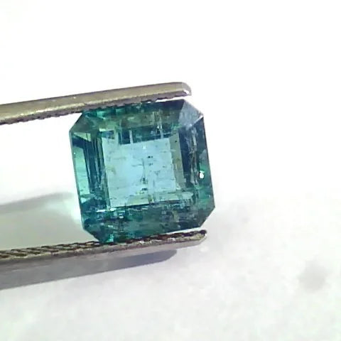 4.12 Ct Untreated Natural Zambian Emerald Gemstone Panna AAA, octagonal cut, vibrant green color, held by tweezers.