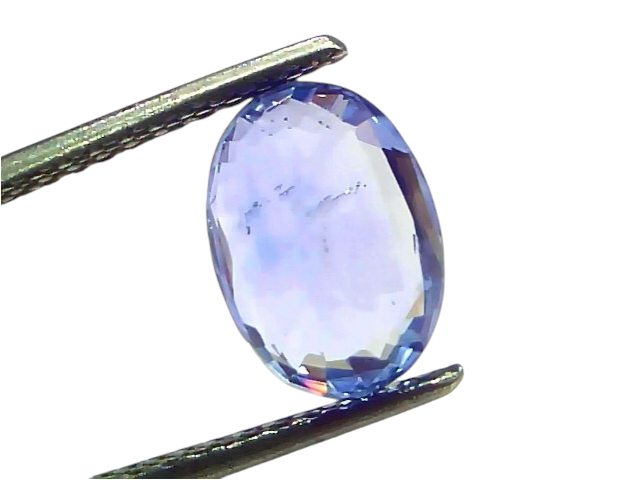 Venus Gems 4.62 carat unheated natural Ceylon blue sapphire gemstone held in tweezers, showing deep blue clarity.