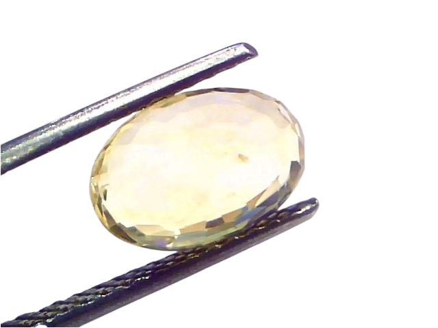 4.54 Ct IGI Certified Unheated Natural Ceylon Yellow Sapphire Pukhraj displayed in tweezers, showcasing its oval cut and clar