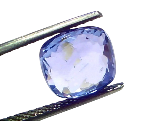 4.49 carat IGI certified unheated natural Ceylon blue sapphire, cushion cut, displayed between tweezers on a white background