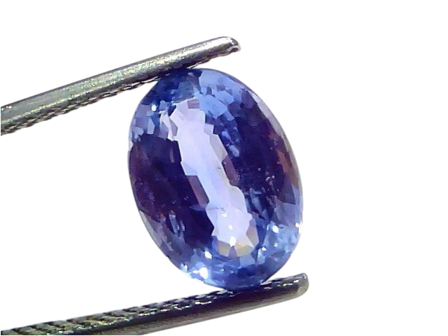 Venus Gems 4.62 carat unheated natural Ceylon blue sapphire gemstone held in tweezers, showing deep blue clarity.