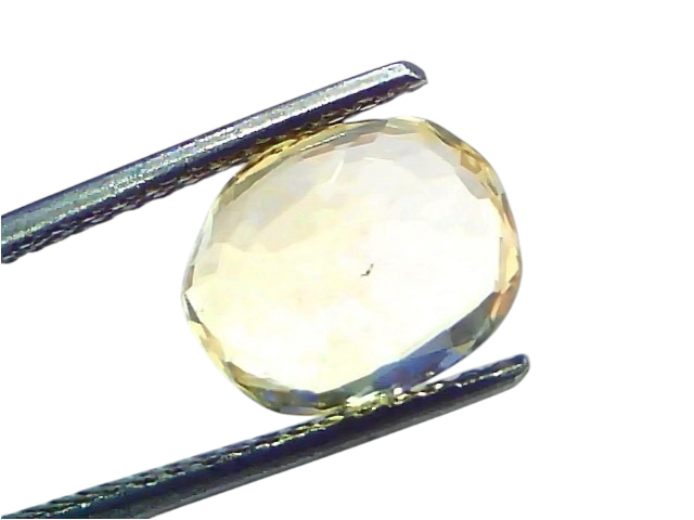 4.08 Ct IGI Certified Unheated Natural Ceylon Yellow Sapphire Pukhraj with a brilliant cut, held between tweezers.