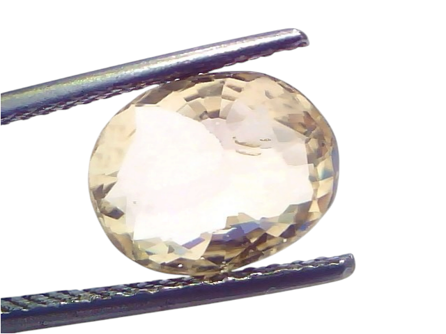 4.00 carat IGI certified unheated natural Ceylon yellow sapphire, oval cut, held by tweezers against a light background.